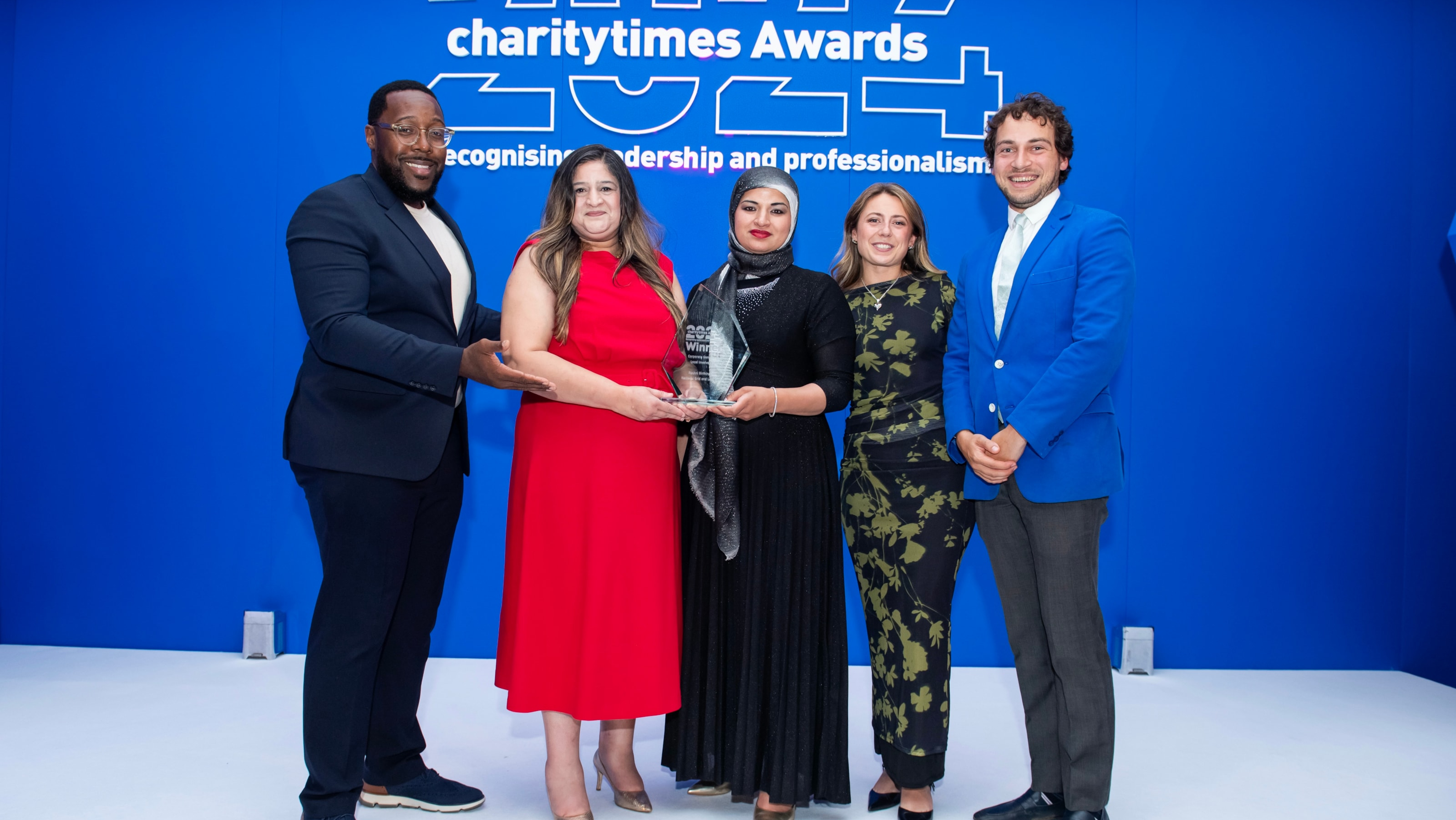 Aurie Styla, Charity Times Awards host,  Surwat Sohail (CEO, Roshni Birmingham), Shaila Pervez (Manager, Roshni Birmingham), Ellie Patey (Community Engagement Manager, National Grid), Andrei Yusfin (CEO, Lo.jpg